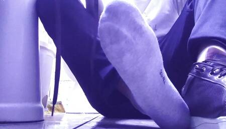 RELAXING MY SWEATY GRAY SOCKS AND MY SIZE 10 FEET