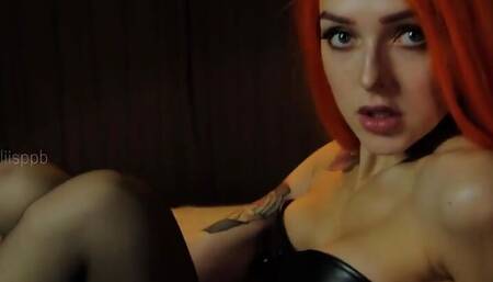 Catwoman in a black corset in black stockings and heels, striptease