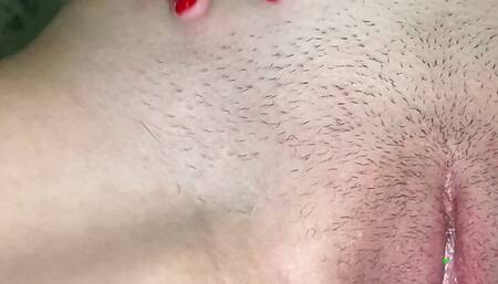 Teen caresses her shaved pussy