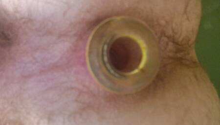 The guy works his ass with a dildo