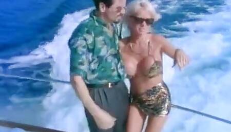 Amazing busty blonde MILF takes dick deeply inside during sailing regatta