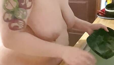 Nude housewife does dishes for you