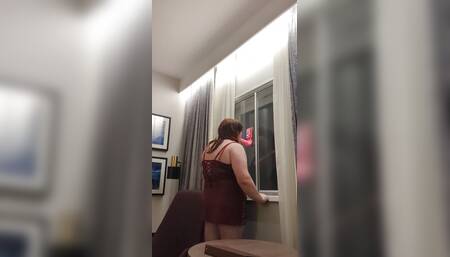 Kelli practices deepthroat infront of the window.