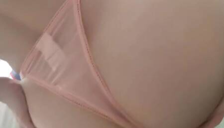A girl strokes her ass in sexy lingerie