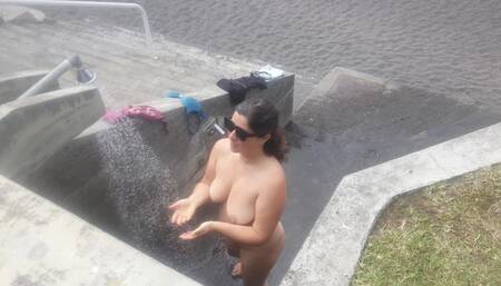 A Curvy Girl gets completely changed and takes Naked a Shower Outdoors on the Beach
