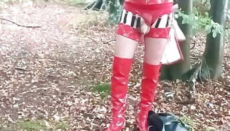 Sissy whore in red outfit and thigh high boots by the side of the road