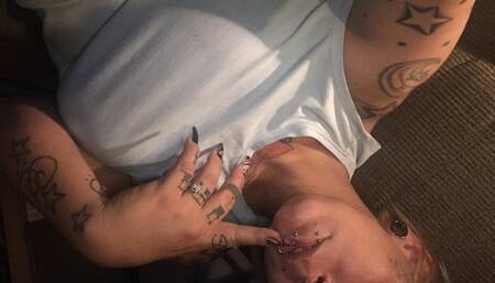 Milf tatted and pierced playing with toy