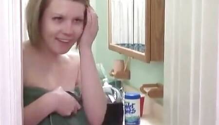 Cute blonde babe masturbates in the shower