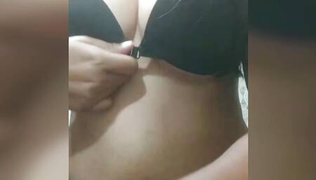 Sexy girl playing undressing and playing with her boobs