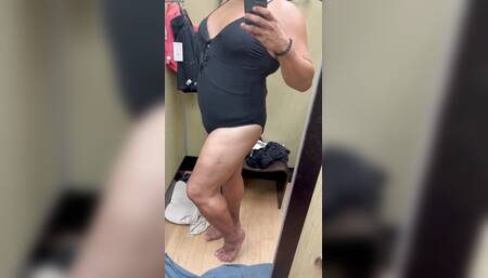 trying on clothes in dressing room