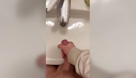 Big cumshot in bathroom by big cock twink