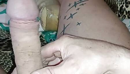 a man plays with his penis.