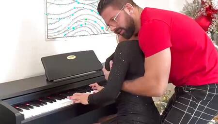 Alice Wild studies her piano teacher's fingering!