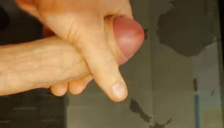 Pulling my long hard cock with cumshot on the glass desk