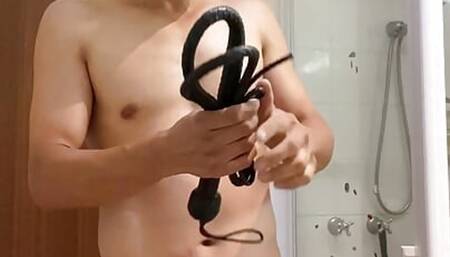 Master learns to use his new whip, testing on a poor slave.