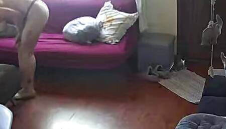 Stepmother is recorded with a camera in the living room while she masturbates