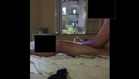 Trying to be caught naked masturbating by neighborhood at open window
