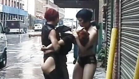 Two lusty whores loves to take advantage of a brunette outdoors