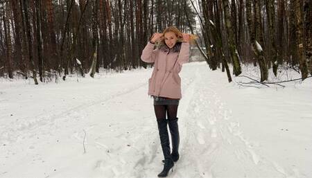 girl in high-heeled boots gets stuck in the snow and falls so many times