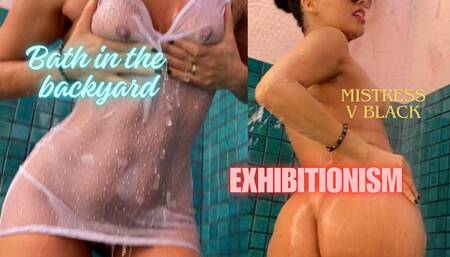 taking a shower in the backyard