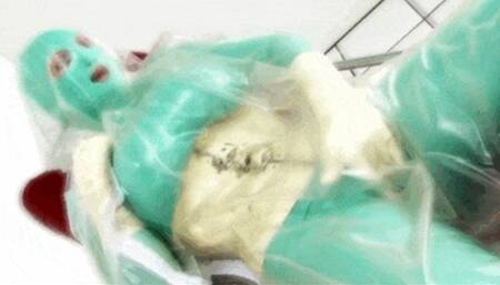 Rubber re-breather slut and her orgsasmus in green latex catsuit - Part 3 of 3 - Playing in transparent plastic vacuum body bag