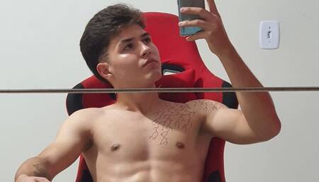 Young boy showing off and masturbating in the mirror