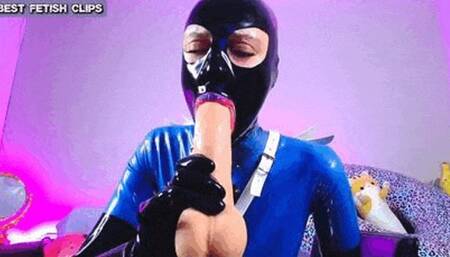 The latex bitch on tour - Watch me as I let a fat dildo disappear completely down my throat