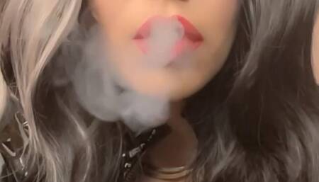 Cruella hair, snow white look, but in latex with a cigarette