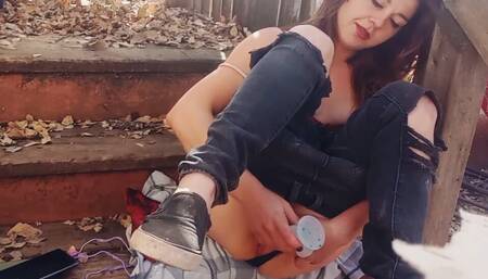 Petite brunette gets horny outside on a deck
