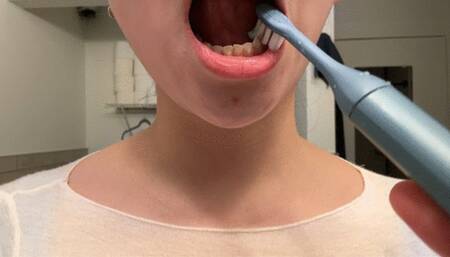 Aurora Brushes Her Teeth, Foaming At The Mouth