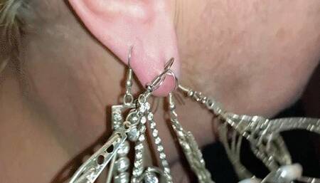 Many heavy earrings on one earlobe WMV