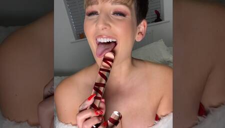 Miss Santa Brooks takes pure delight in using her candy cane in her tight arse xxx