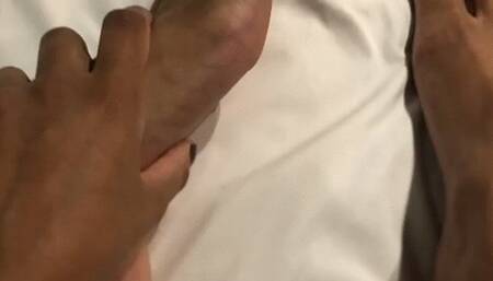 SAYURI APPLYING CREAM TO THE FOOT