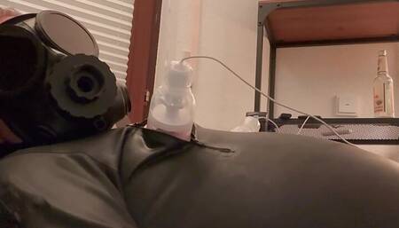 Rubber Gimp Hendrik Gransow jerks off the cum out of his cock