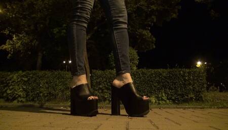 crossdresser in very high platform shoes