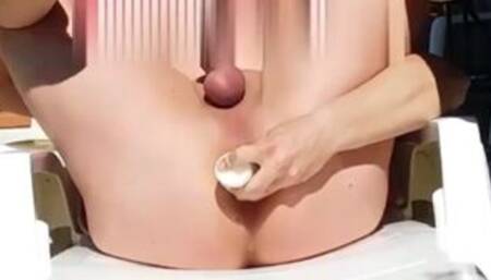 Milk enema outdoor in garden