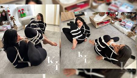 Hogtied in Catsuit Luana watches Simona & Mara's Special Foot Gag