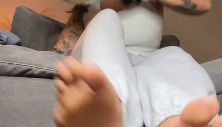 Giantess Sammie makes her tiny slave worship her feet during movie night