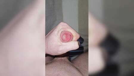 Young pale man masturbating and ejaculating in his bedroom