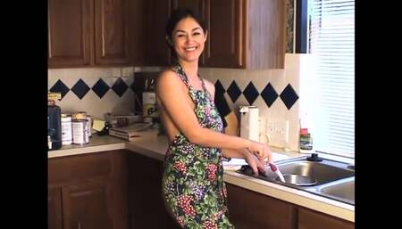 Cher, a Brunette, Performs Alone in the Kitchen Sink