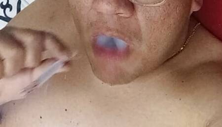 Chubby bator mexican smoking and playing in hotel