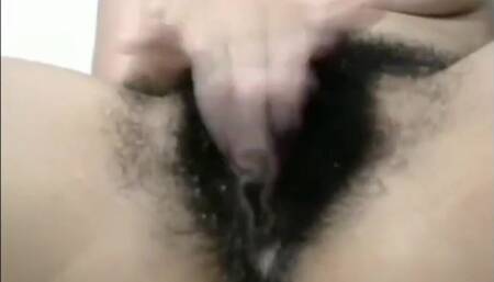 Arab mom Zina rubs extreme hairy cunt