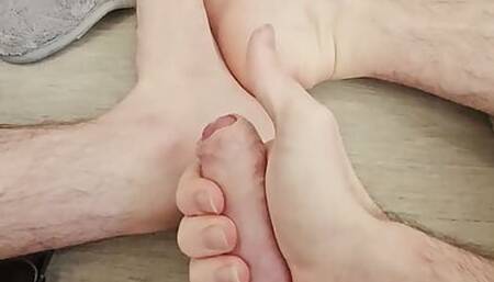 Straight guy playing with his uncut cock until cumming on his feet and rubbing it in.