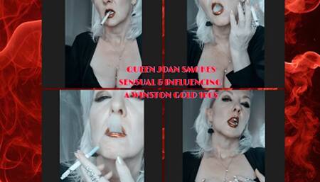 Queen Joan pulls seductively on a Winston Gold 100s with her red metallic lips