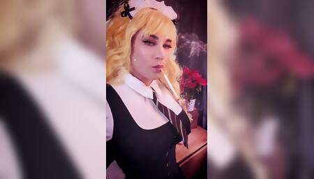 Mrs Dangle dressed as a blonde Schoolgirl, smoking a 164mm cork cigarette