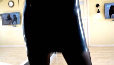 Hottie in tight latex dress shows off her long sexy legs in high heels