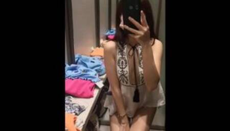 Naughty Instagram asian model try on haul in changing room and expose her shaved pussy