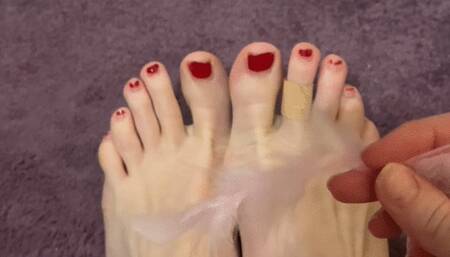 The feather tickling my soles and nose