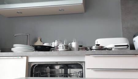 Grandad empties the dishwasher