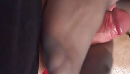 Footjob in grey stockings